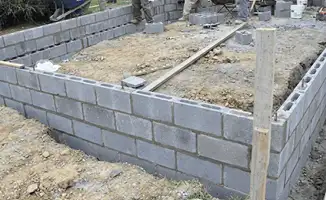 Professionals building a foundation with blocks in Pembroke Pines, FL