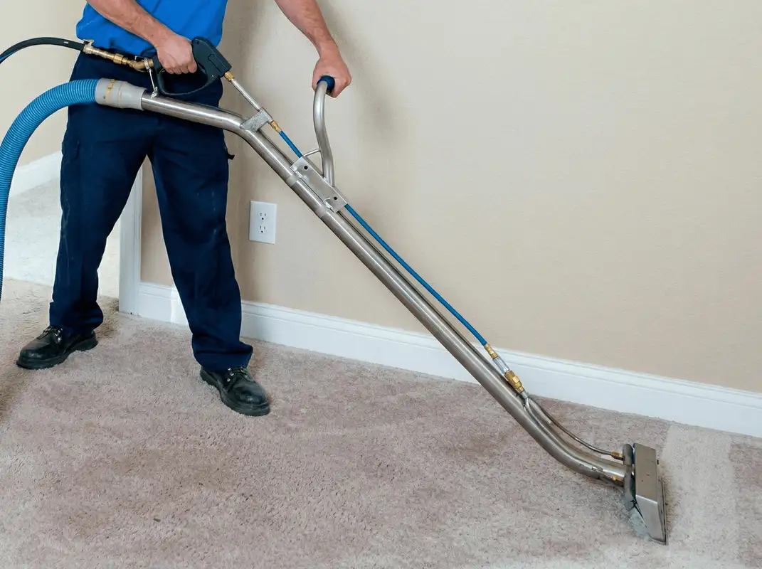Professional operating a liquid removal machine on a carpeted floor in Pembroke Pines, FL